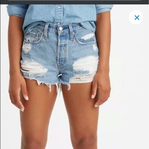 Distressed light wash Levi’s shorts